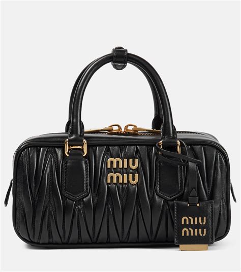 miu miu bag black leather|farfetch miumiou bags.